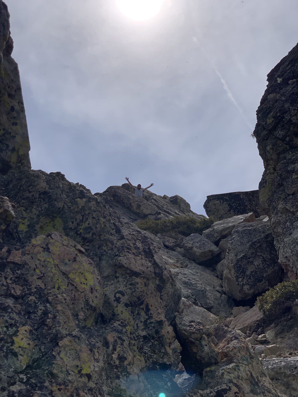 Adam, a developer, at the top of a cliff climb on a Boxcar retreat